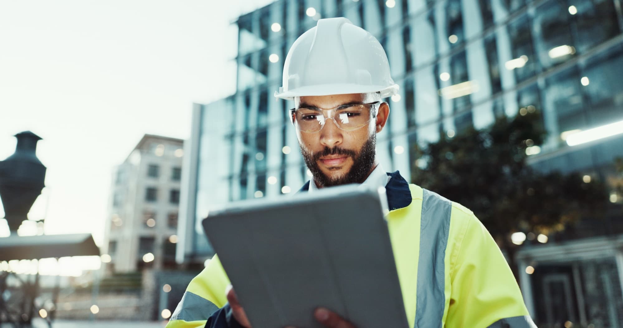 Quantity surveyor reviewing project figures on a tablet