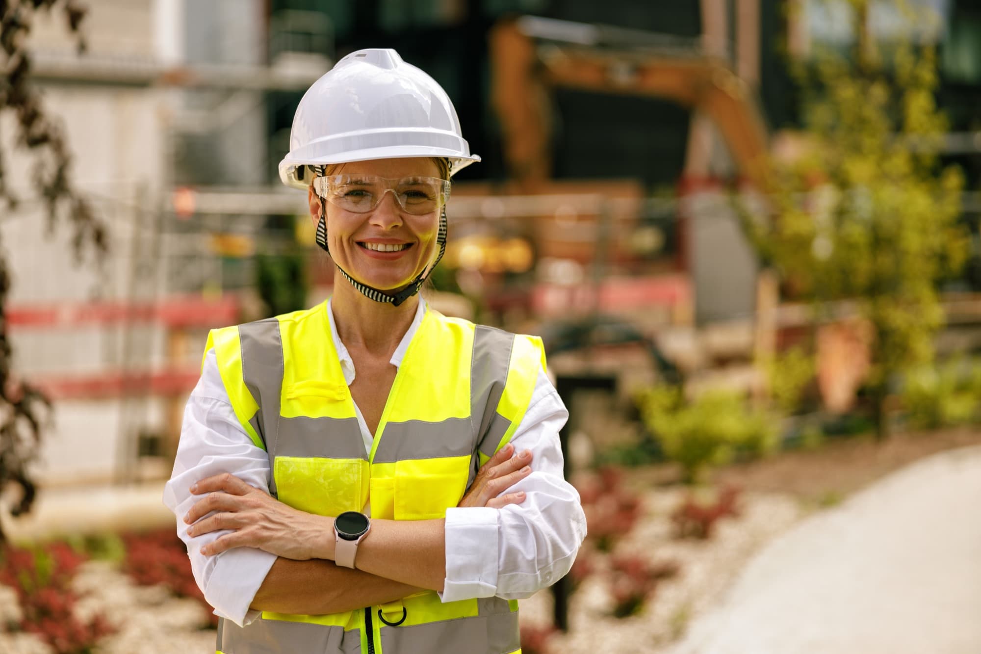 Construction worker in full safety gear on site