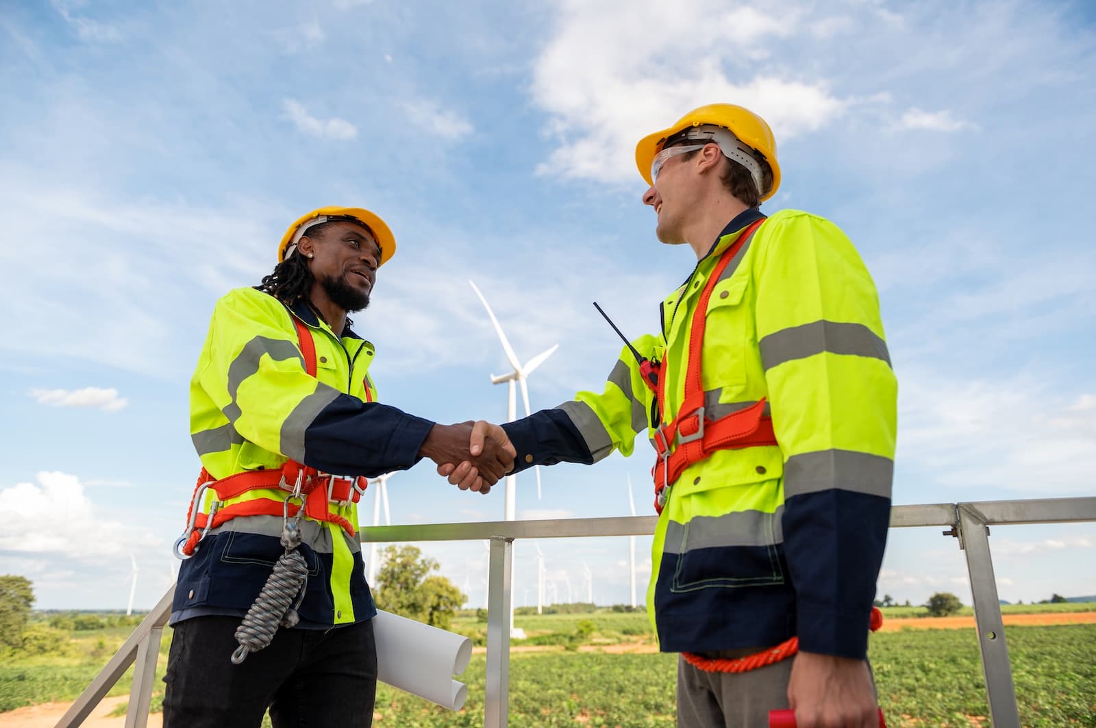 Contractor and subcontractor shaking hands on site